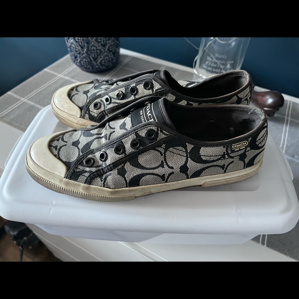 Black coach sneakers.